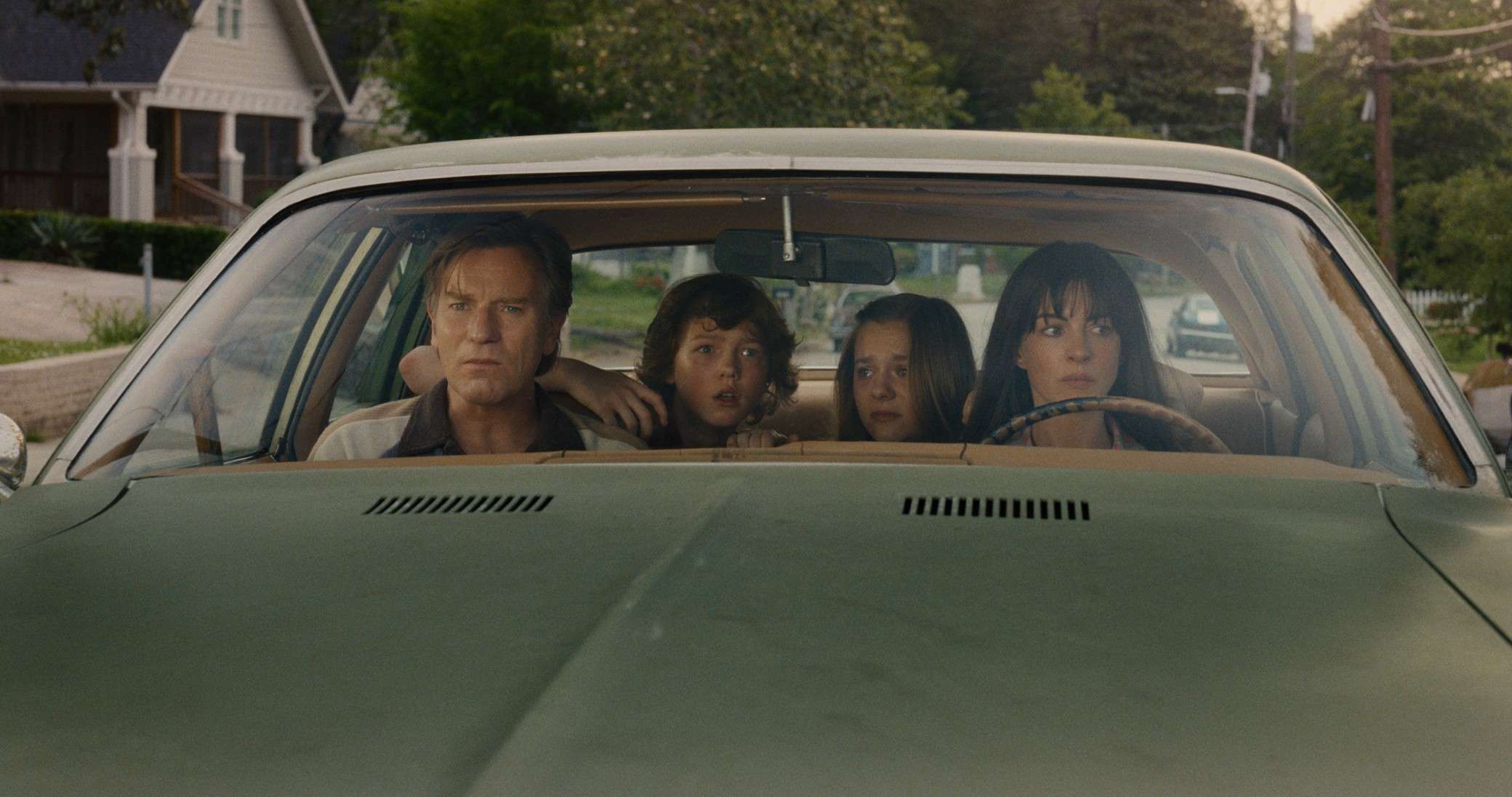 In order from left to right: Ewan McGregor, Christian Convery, Maisy Stella, and Anne Hathaway in 'The End of Oak Street.'
